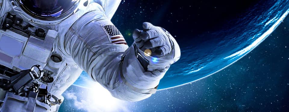 From the key art for Lonely No More: an astronaut's gloved hand reaches across the curve of a glowing planet.
